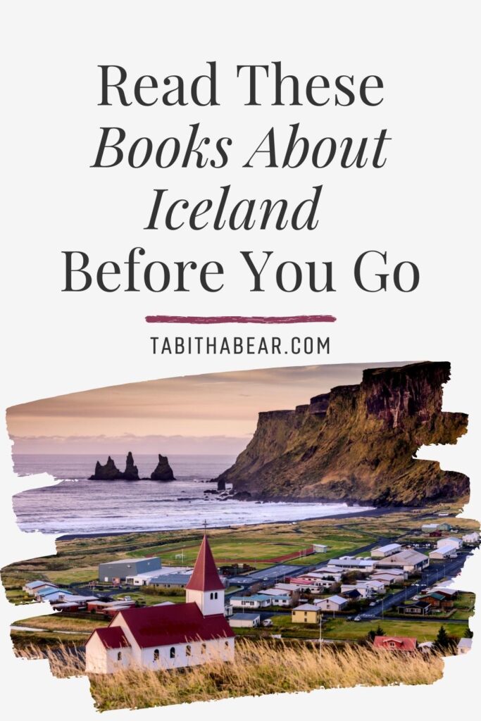 Photo of an oceanside town in Iceland from a hilltop, showing buildings and a church below. Text above the photo reads "Read These Books About Iceland Before You Go."