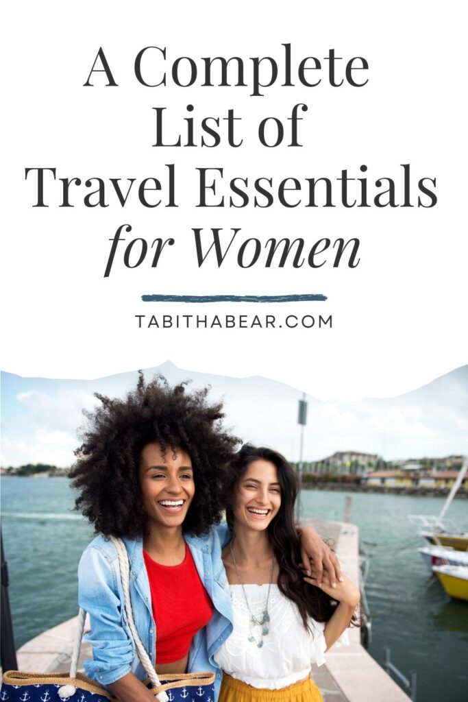 Photo of 2 women laughing while on a boat. Text above the photo reads: A Complete List of Travel Essentials for Women.